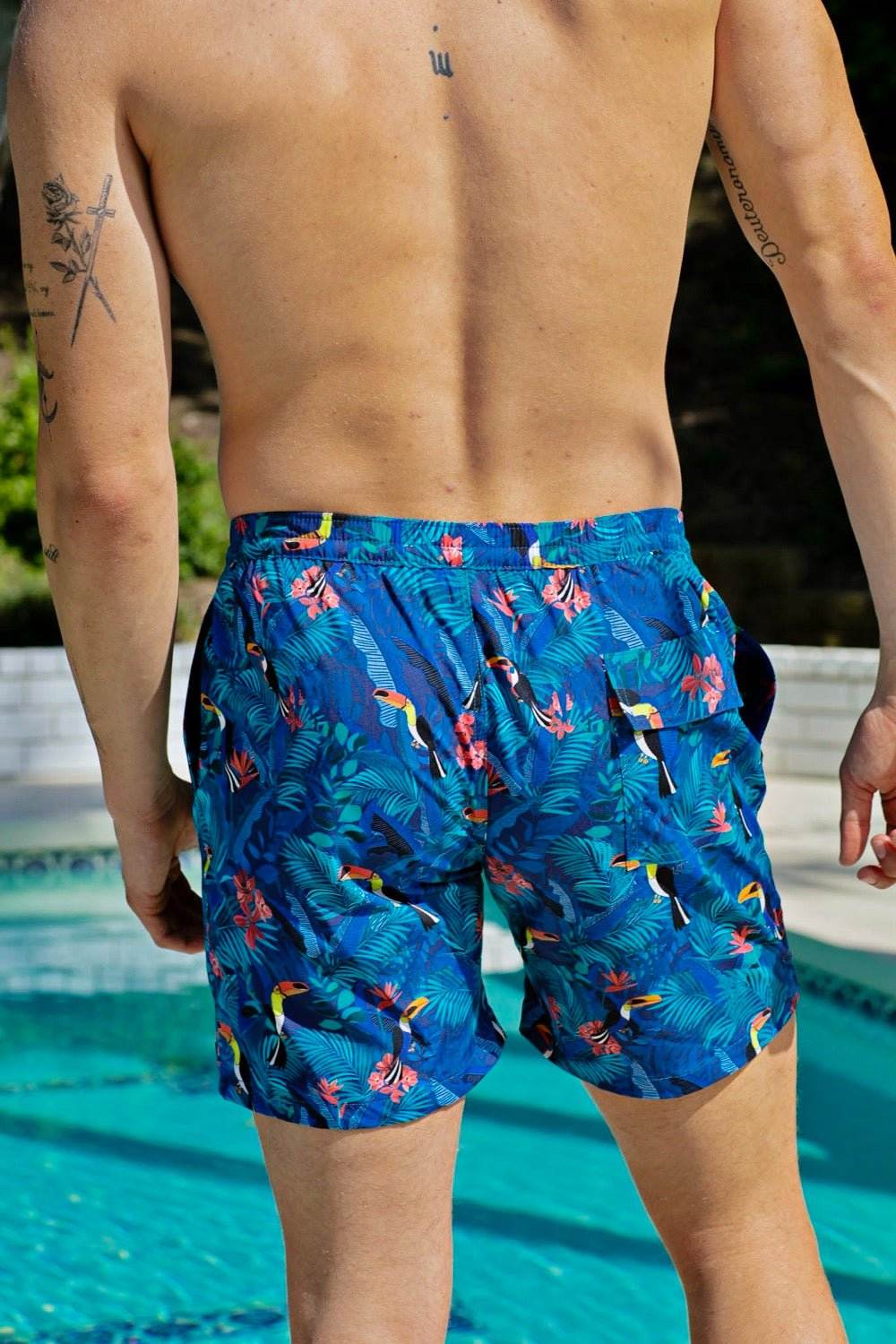 swimsuit model on beach Toucan Trunks